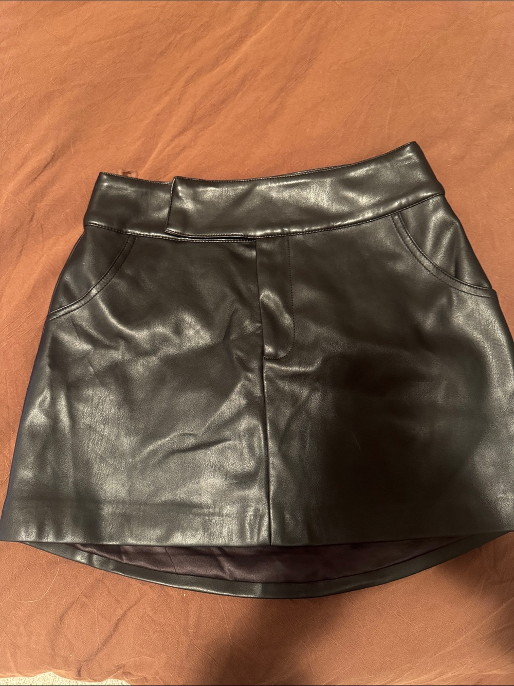 Meshki Black Faux Leather Mini Skirt with Curved Hem